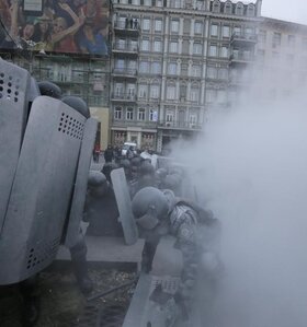 Riot police clash with protesters in central Kiev, Ukraine, Sunday, Jan. 19, 2014. Hundreds of protesters on Sunday clashed with riot police in the center of the Ukrainian capital, after the passage of harsh anti-protest legislation last week seen as part