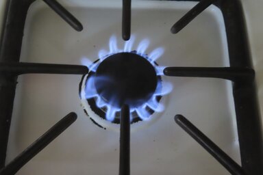 Natural gas burns on a kitchen stove in Atlantic City N.J., Thursday, July 26, 2023. Government pushes to move buildings and vehicles away from burning fossil fuels to help address climate c