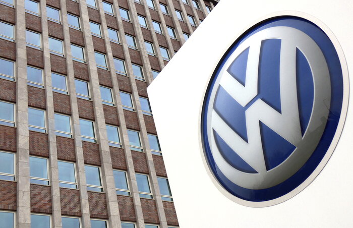 FILE - In this Friday, April 13, 2018 file photo,  Volkswagen logo is pictured in front of a company building in Wolfsburg, Germany. German carmaker Volkswagen reports second-quarter earning