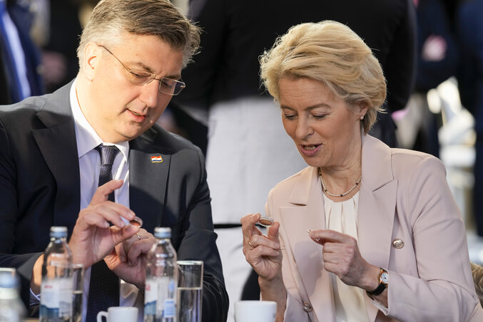 Croatia's Prime Minister Andrej Plenkovic and Ursula von der Leyen, President of the European Commission, inspect Croatian euro coins in Zagreb, Croatia, Sunday, Jan. 1, 2023. Croatia switch